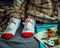 The girl`s feet are covered with a plaid plaid and covered with bright Christmas socks with snowmen. There is a tray of