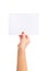 Girl`s hand holding a small sheet of paper. Blank paper for text presentation