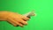The girl`s hands count the dollars and give the part to the debt collector against the background of the green screen