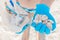 The girl`s hands in protective blue latex medical gloves hold a bag of garbage and a bunch of shells close-up. Problems of