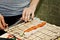 Girl`s hands twisting rolls and sushi close-up