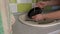 Girl's Hands are Washing Plate with Washcloth and Detergent in Full Sink Slowmo