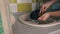 Girl's Hands are Washing Plate with Washcloth and Detergent in Full Sink Slowmo