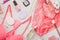 Girl`s morning rituals concept. Flat lay with pink lingerie, make-up, skin care