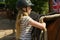 Girl saddling horse