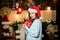 Girl in santa claus hat. Christmas shopping. Christmas tree. Winter holiday. Sexy woman with present box. Happy new year