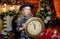 Girl santa claus hat and clock. Meet Christmas holiday. Festive atmosphere christmas day. New year countdown. Counting