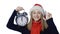 Girl in Santa hat with alarm clock counting fingers