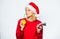 Girl santa hat drink juice lemon straw while hold pile of money. Symbol of wealth and prosperity. Christmas wishes. Rich
