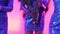 A girl with a saxophone, a musical group of girls with a saxophone perform on stage, a blue dress, a stage light, a