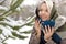 Girl in a scarf and a fashionable winter multi-colored manicure