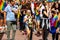 Girl with sceptical look waving rainbow flag