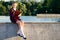 Girl after school classes sits in a park in the fresh air