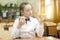 Girl in school uniform chooses food for lunch