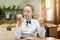 Girl in school uniform chooses food for lunch