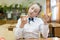 Girl in school uniform chooses food for lunch