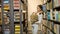 Girl-schoolgirl chooses books to read in the library.