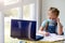 Girl schoolgirl does online homework lessons. Internet school, distance learning, quarantine