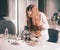 Girl schoolgirl uses a microscope in the school laboratory.