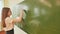 Girl schoolgirl writes on the blackboard mathematical formulas.