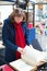 Girl selecting a book on Parisian flea market