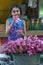A girl selling lotus flowers at Kataragama temple complex in southern Sri Lanka.