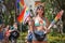 Girl selling rainbow flags at Pride Parade