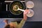 The girl serves the soup with a ladle.