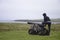 Girl shooting cannon Orkney coastline cliff landscape