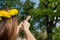 Girl shooting from the professional wooden slingshot