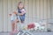 Girl with shopping basket in supermaket