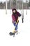 Girl shoveling snow