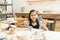 Girl Showing Clay Butterfly Painted By Her In Pottery Class