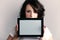 girl showing copy space on tablet touchpad