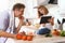 Girl showing her father a digital recipe from a tablet