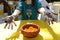 A girl is showing of her hand mehendi.