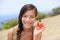 Girl showing natural fresh cashew nut apple fruit