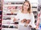 Girl showing powders in makeup store