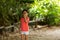 Girl showing quiet sign while walking outdoors