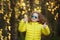 girl showing thumbs up, walking in the park.