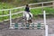 Girl at a showjumping competition.