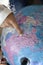 Girl shows a hand on a big globe. World map. School globe. The study of geography