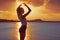 Girl silhouette at beach sunset heart shape