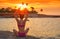 Girl silhouette at beach sunset heart shape