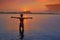 Girl silhouette at beach sunset open arms