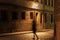 Girl silhouette in motion on night illuminated street