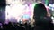 Girl silhouette on shoulders dancing at concert