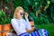 Girl sit bench relaxing in shadow, green nature background. Lady needs relax and vacation. Woman blonde with sunglasses