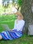 Girl sit grass lean tree trunk with notebook. Wi fi network connection free access. Surfing internet in nature. Woman