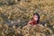 Girl sit in wheat field